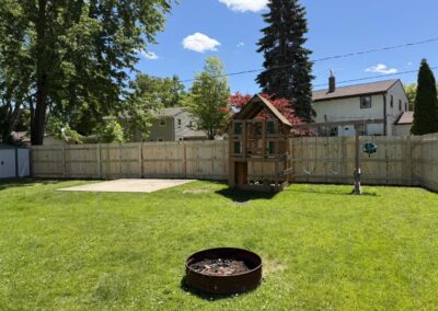 Kaukauna WI: Treated wood privacy fence enclosing a backyard