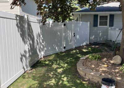 Appleton WI: White vinyl privacy fence with a matching gate